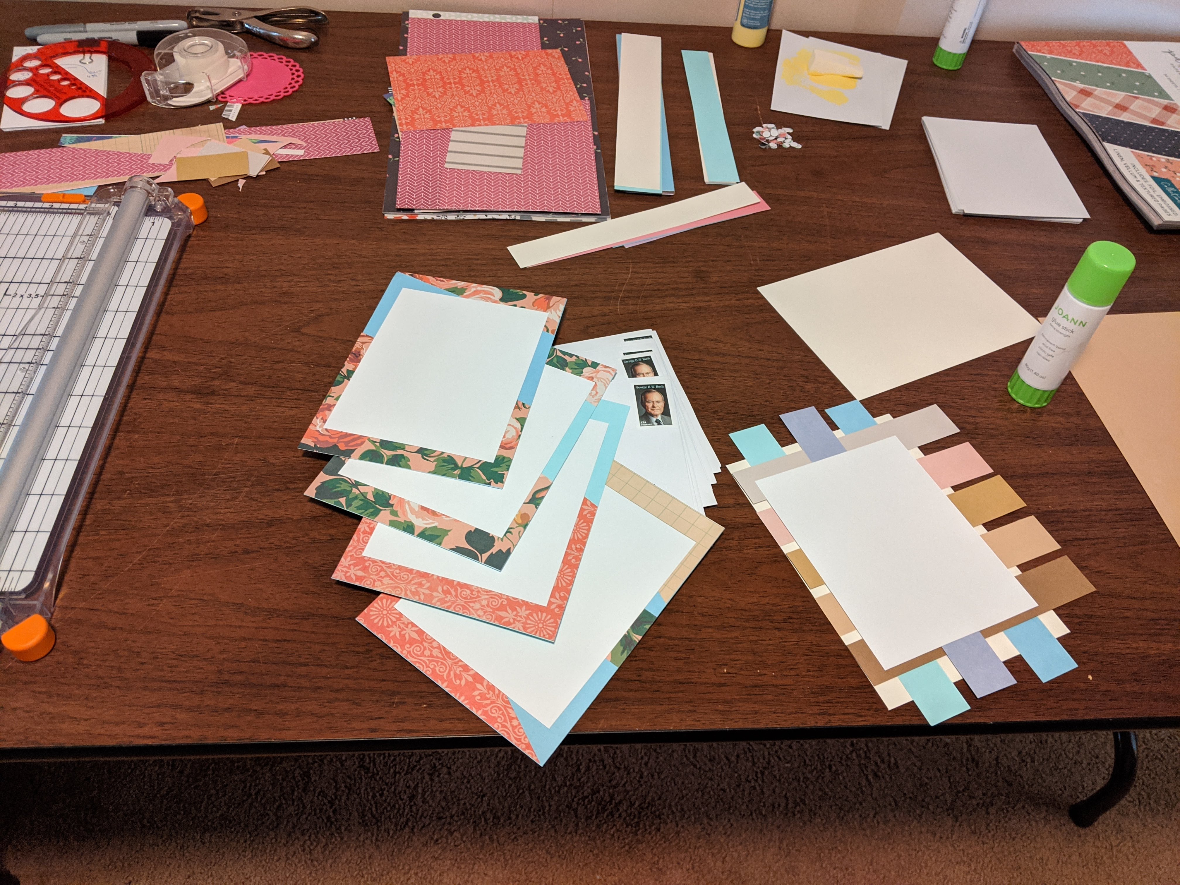 Papercrafts, the beginnings of wedding invitations, on a table